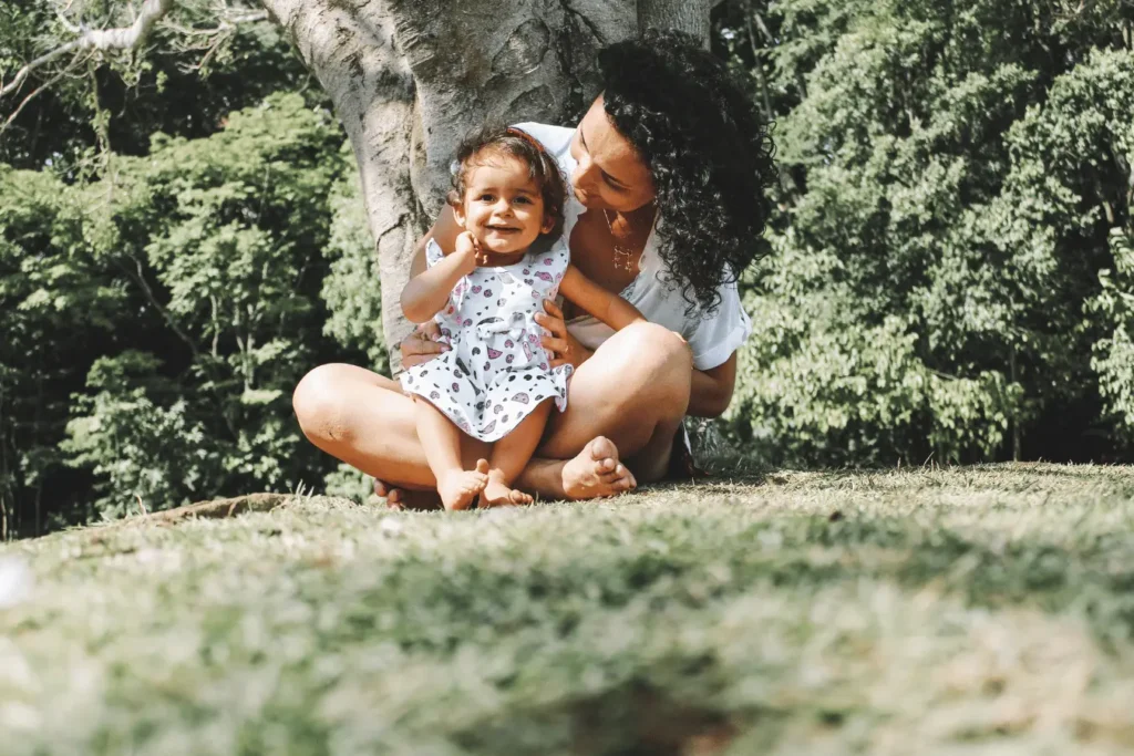 Mother and daughter at the base of a tree - spring time