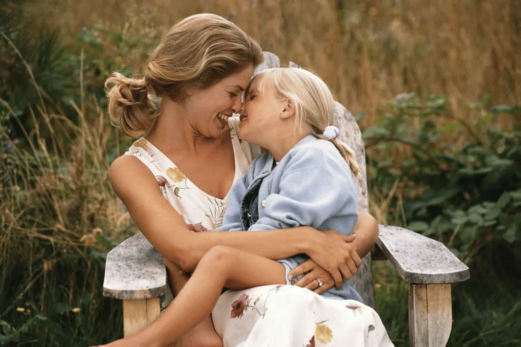 Mother with daughter on chair outside in nature