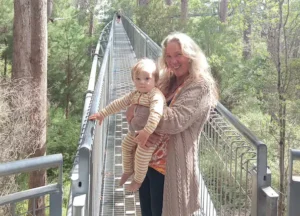 Debbie of Debbie Savage Therapies with her grandchild in nature